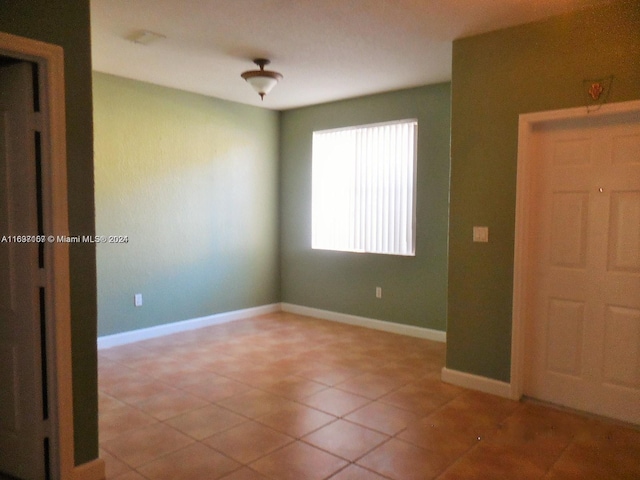 view of tiled spare room