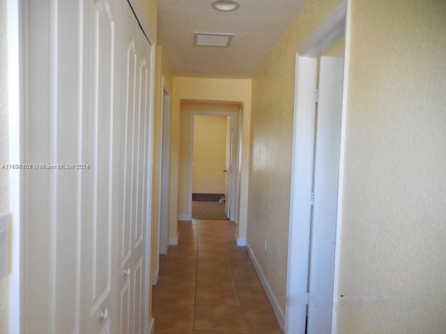 hallway featuring tile patterned floors