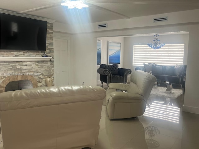 tiled living room featuring a notable chandelier