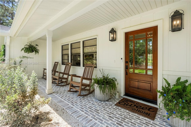 doorway to property featuring covered porch