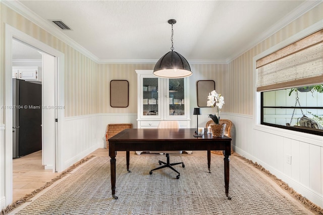 office featuring light wood-type flooring and ornamental molding