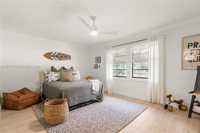 bedroom featuring wood-type flooring, ceiling fan, and ornamental molding