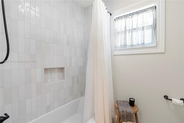 bathroom featuring shower / bath combo with shower curtain