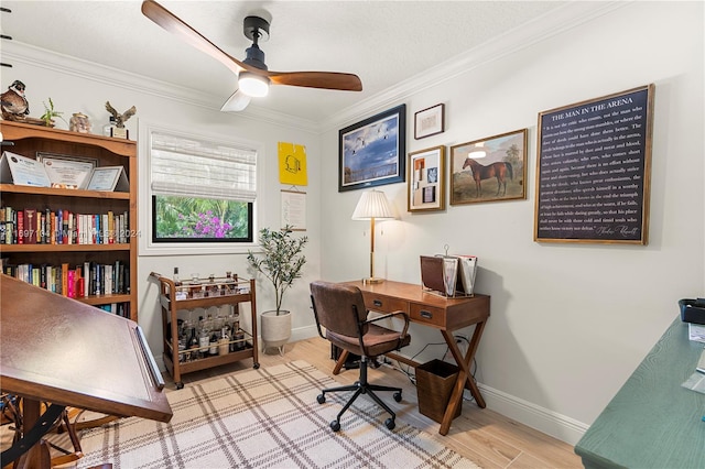 home office with ceiling fan, light hardwood / wood-style flooring, and crown molding