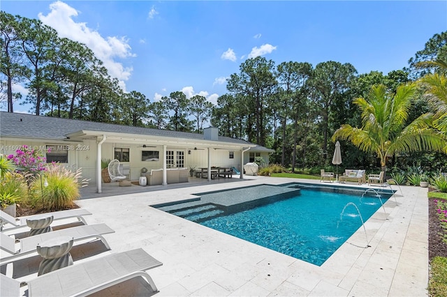 view of pool with pool water feature, an outdoor hangout area, ceiling fan, and a patio area