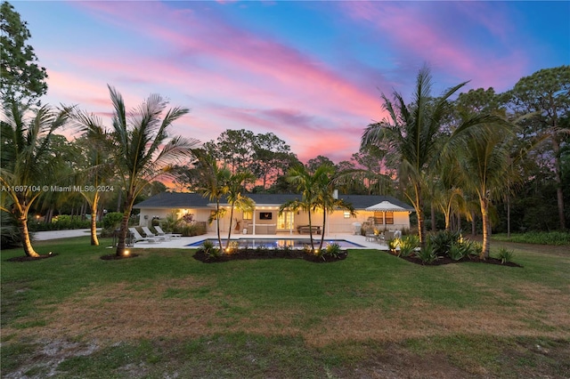 yard at dusk with a patio