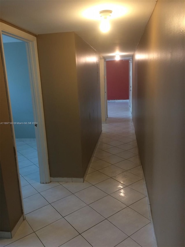 corridor with light tile patterned floors