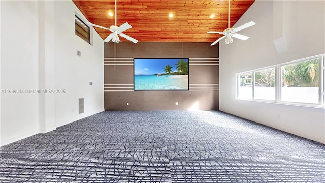 unfurnished room featuring ceiling fan, wooden ceiling, and high vaulted ceiling