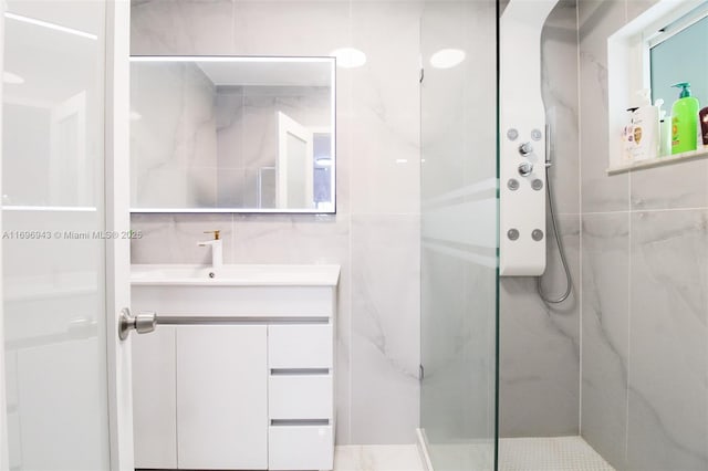 bathroom featuring vanity and a tile shower