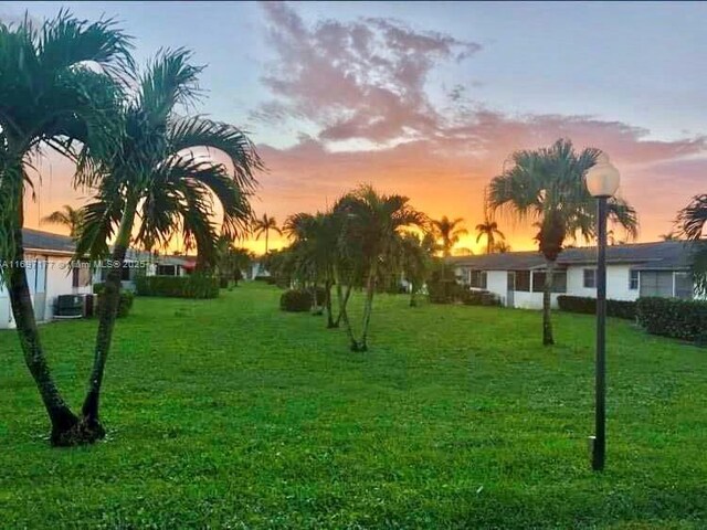 view of property's community featuring a yard