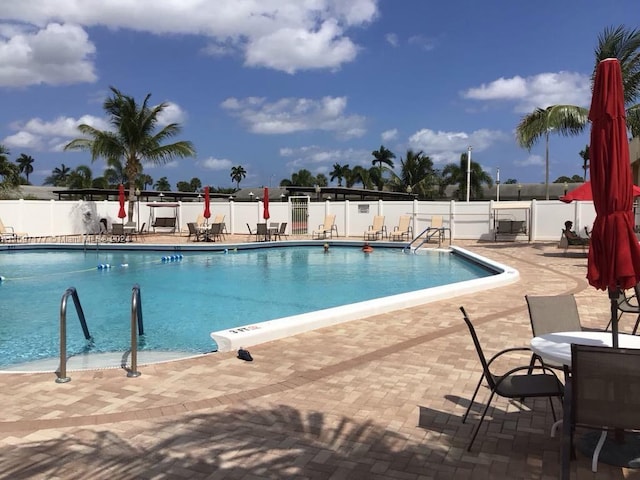 view of swimming pool featuring a patio