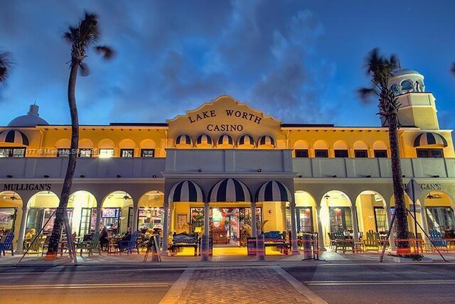 view of outdoor building at dusk