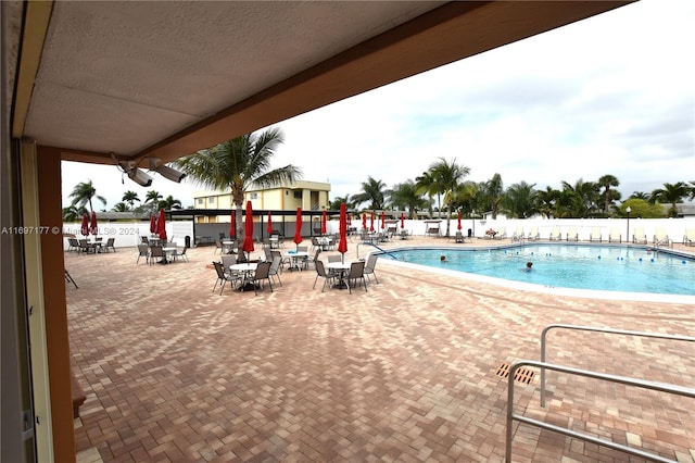 view of swimming pool featuring a patio