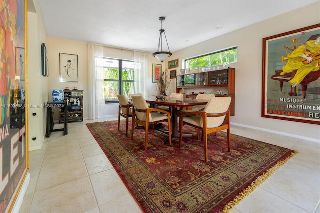 dining area with light tile patterned floors