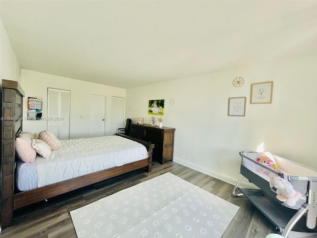 bedroom featuring dark hardwood / wood-style flooring and a closet