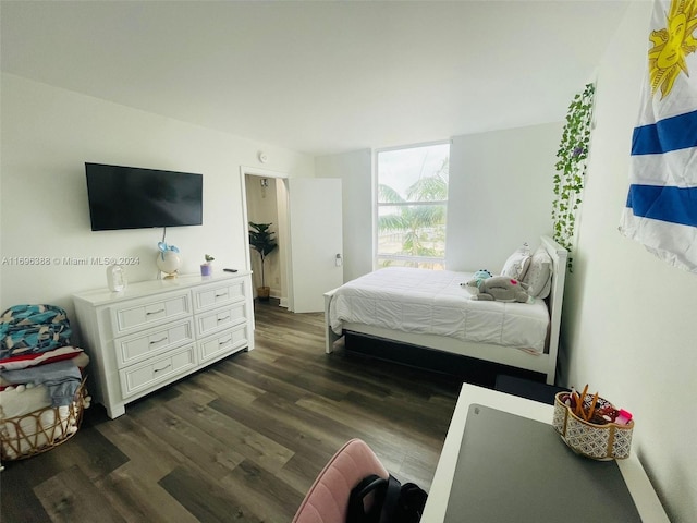 bedroom featuring dark hardwood / wood-style flooring