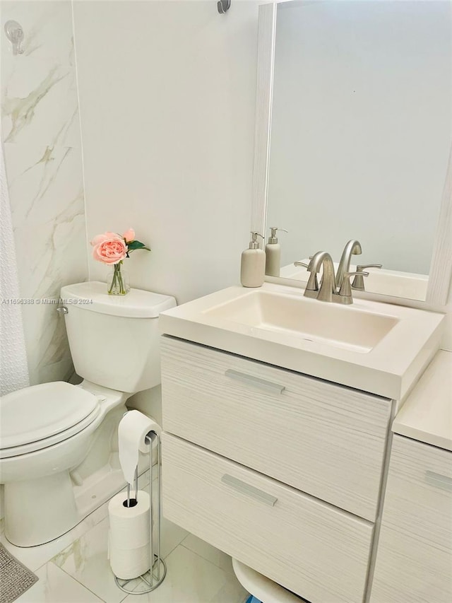 bathroom with vanity and toilet