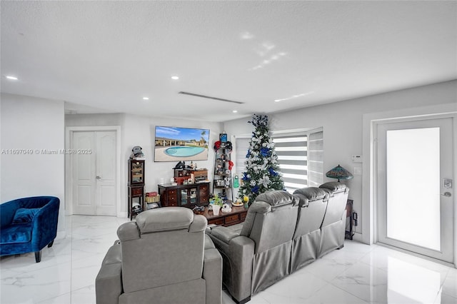 living room featuring a textured ceiling