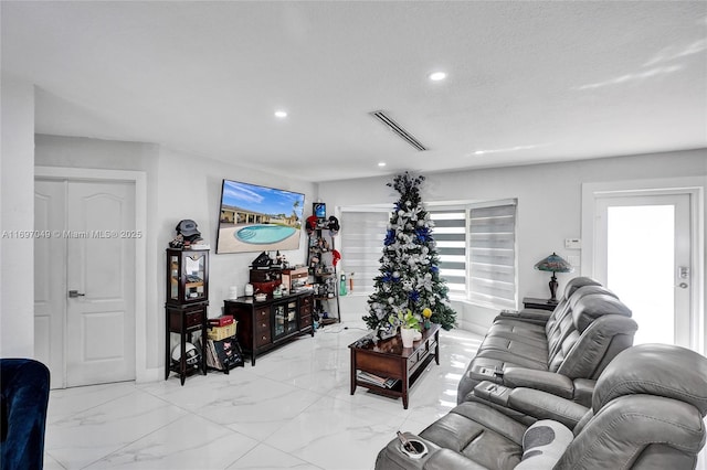 living room featuring a textured ceiling