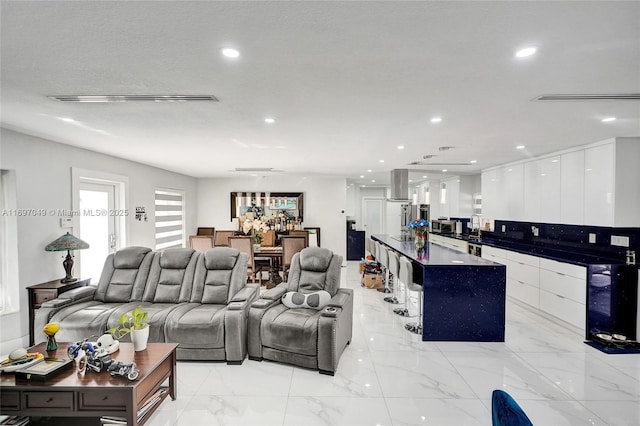 living room with sink and a textured ceiling