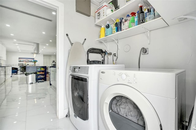 laundry area with independent washer and dryer