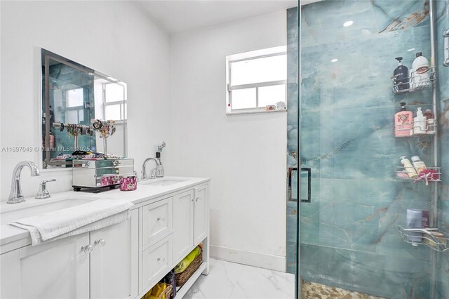 bathroom featuring vanity and an enclosed shower