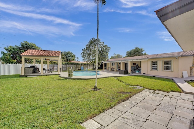 view of yard featuring a fenced in pool and a patio area