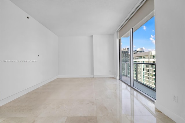 unfurnished room featuring a wealth of natural light