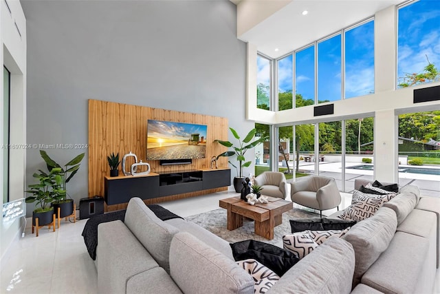 tiled living room with a high ceiling