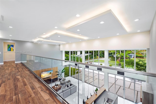 hall with hardwood / wood-style floors and plenty of natural light