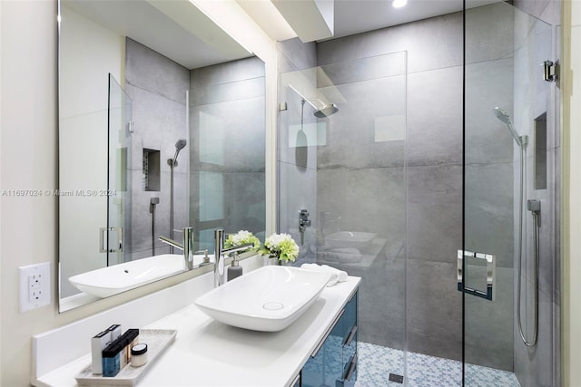 bathroom with vanity and an enclosed shower