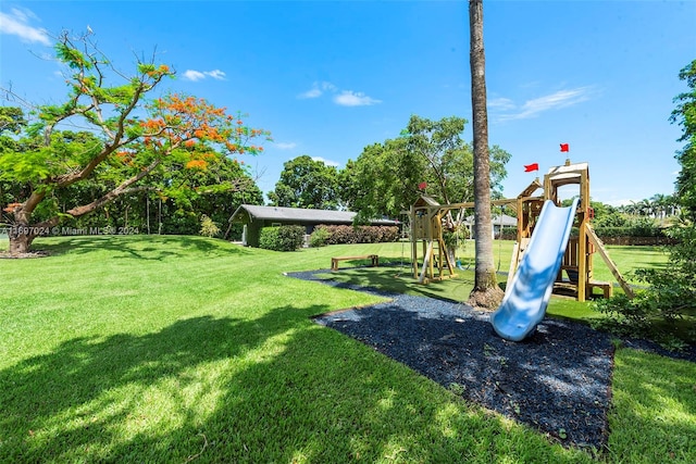 view of jungle gym with a lawn