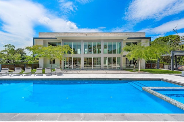 view of pool featuring an in ground hot tub and a patio