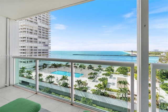 balcony featuring a water view