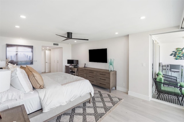 bedroom with ceiling fan and light wood-type flooring