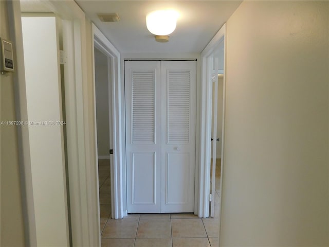 hallway featuring light tile patterned floors