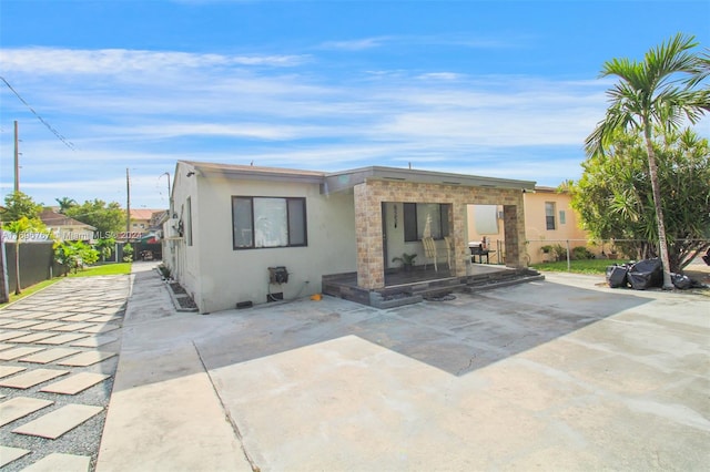 rear view of house with a patio