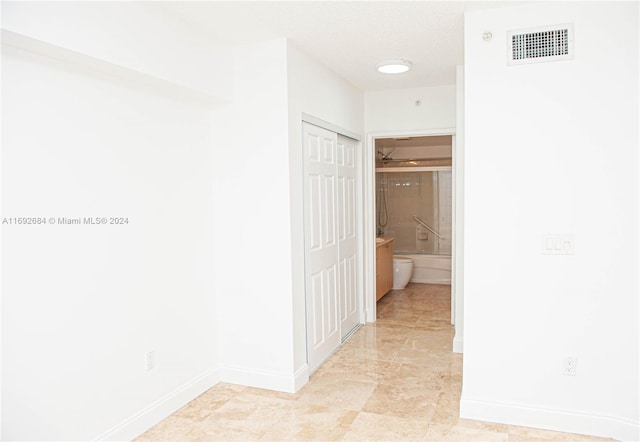 corridor featuring a textured ceiling