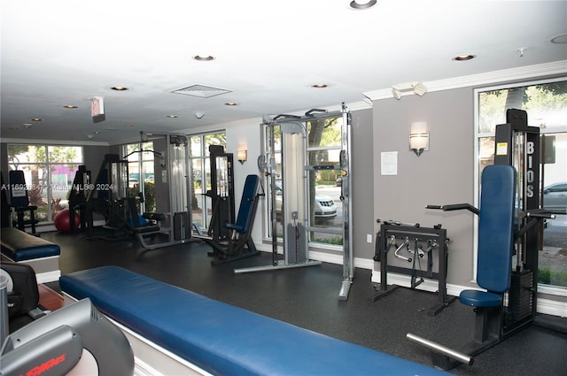 exercise room with ornamental molding