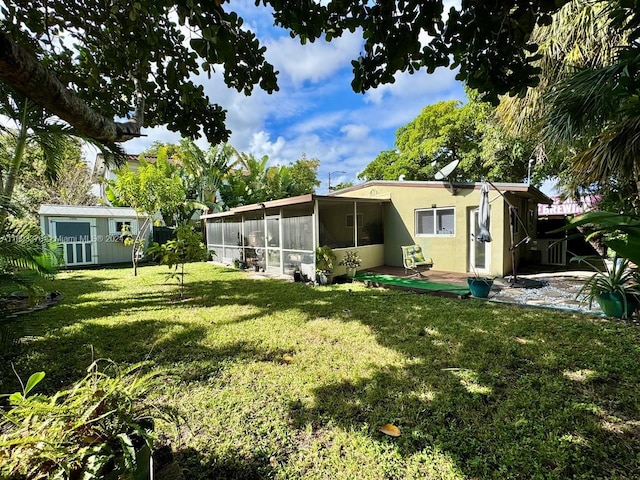 view of yard with a sunroom