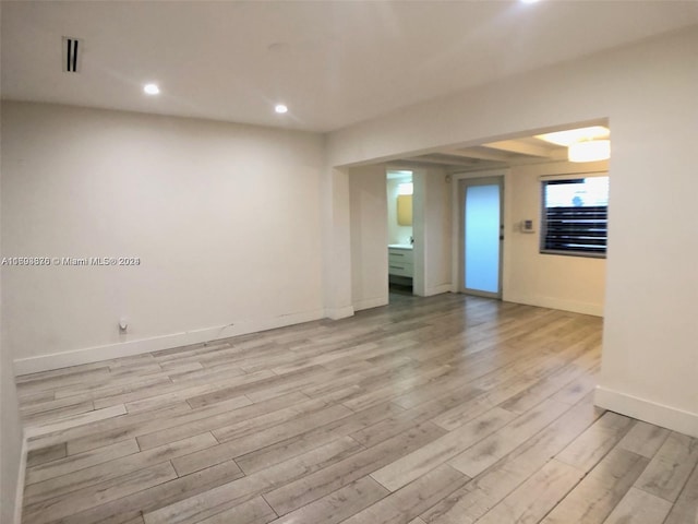 unfurnished room featuring light hardwood / wood-style floors