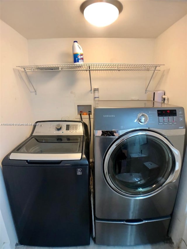 laundry room featuring washing machine and dryer