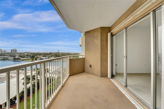 balcony featuring a water view