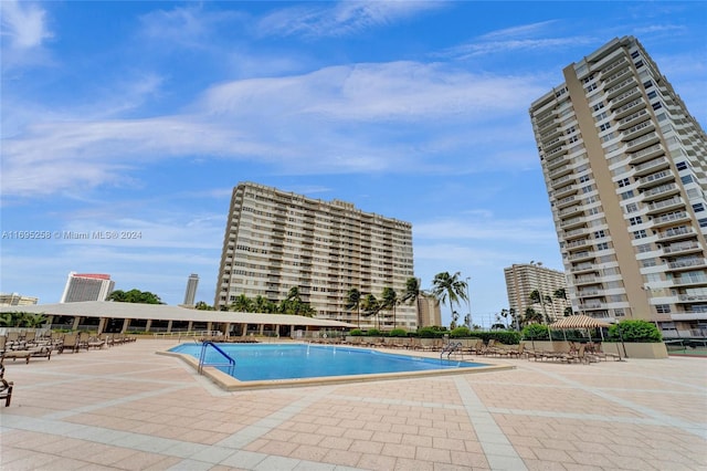 view of swimming pool with a patio area