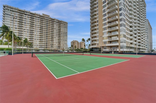 view of tennis court featuring basketball court