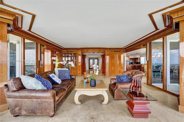 living room featuring wooden walls and crown molding