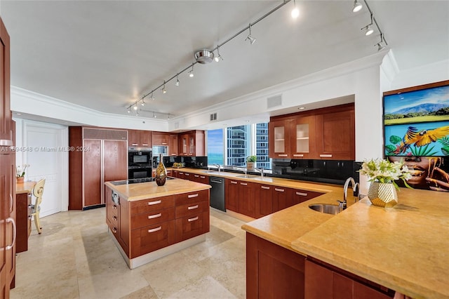 kitchen featuring decorative backsplash, crown molding, sink, dishwasher, and a kitchen island