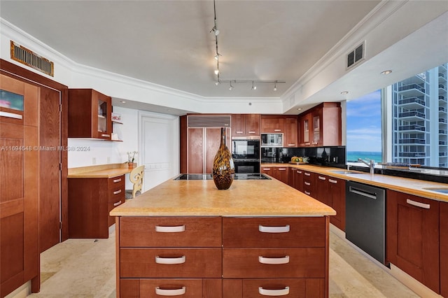 kitchen with track lighting, black appliances, decorative backsplash, ornamental molding, and a kitchen island