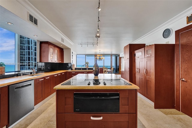 kitchen featuring a notable chandelier, dishwasher, a water view, and crown molding