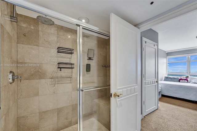 bathroom featuring a shower with shower door